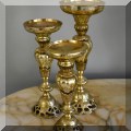 D04. Set of 3 brass candle stands. 